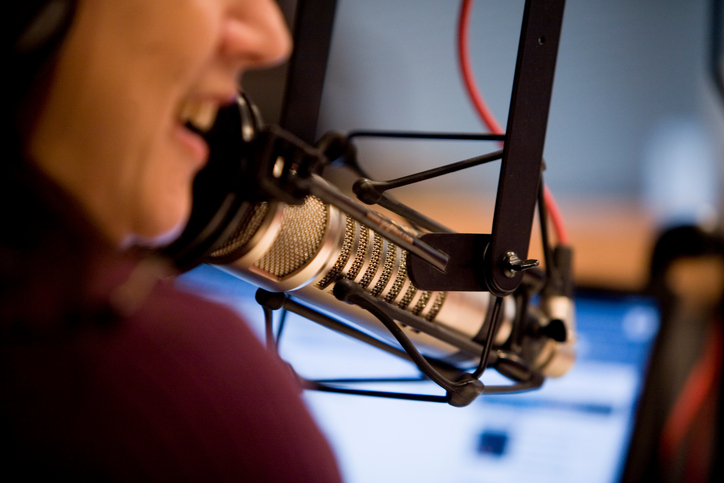 woman on microphone live radio